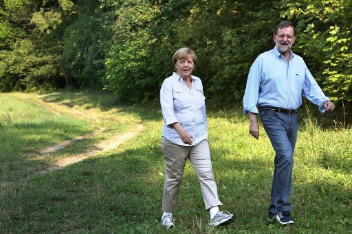 German Chancellor Angela Merkel (CDU) welcomes the Spanish Prime Minister Mariano Rajoy at Meseberg Palace, close to Berlin, Germany, 31 August 2015. After the official welcome they took a walk to the riverbanks of Lake Hugenow. Photo: Stephanie ...