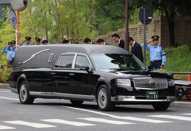July 12, 2022, Tokyo, Japan - A hearse carrying body of former Japanese Prime Minister Shinzo Abe passes prime minister\