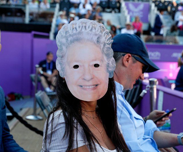 14th June 2022; Queens Club, West Kensington, London, England; Cinch Queens Club ATP Tour 500 series Lawn Tennis tournament; Tennis fan wearing a mask of Queen Elizabeth II next to Centre