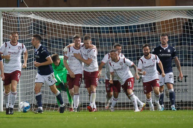 12th August 2022; Dens Park, Dundee, Scotland: Scottish League Championship football, Dundee versus Arbroath ; Colin Hamilton of Arbroath is congratulated after scoring for 2-2 by Thomas O\