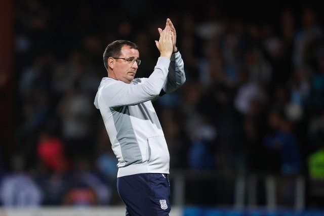 12th August 2022; Dens Park, Dundee, Scotland: Scottish League Championship football, Dundee versus Arbroath ; Dundee manager Gary Bowyer applauds the fans at the end of the