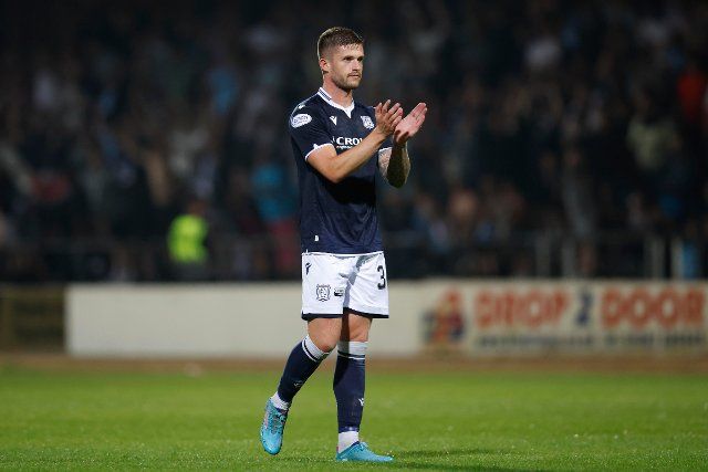 12th August 2022; Dens Park, Dundee, Scotland: Scottish League Championship football, Dundee versus Arbroath ; Joe Grayson of Dundee applauds the fans at the end of the