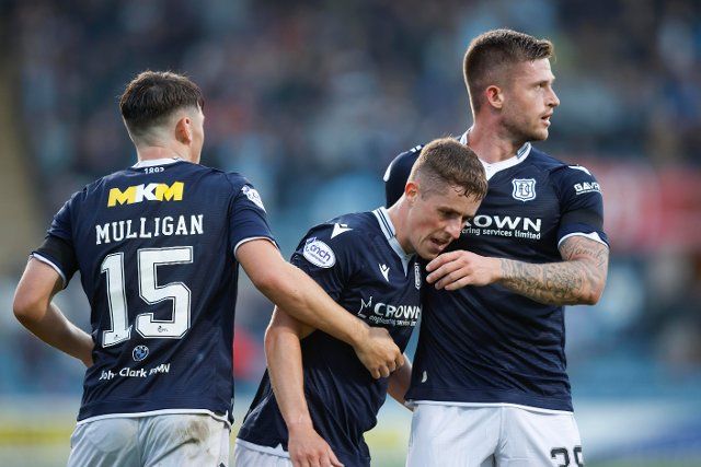 12th August 2022; Dens Park, Dundee, Scotland: Scottish League Championship football, Dundee versus Arbroath ; Luke McCowan of Dundee is congratulated after scoring for 1-0 by Josh Mulligan and Joe Grayson