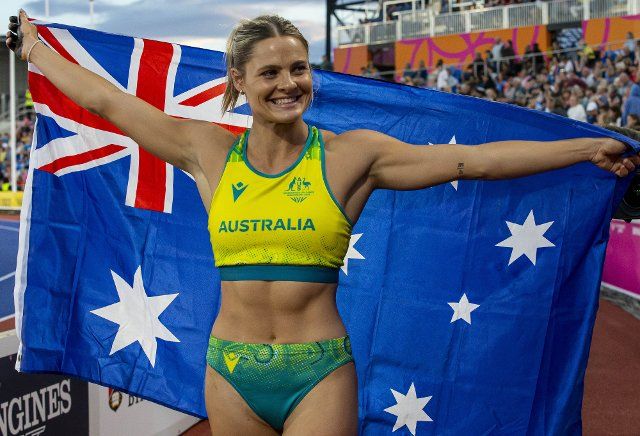 2nd August 2022; Alexander Stadium, Birmingham, Midlands, England: Day 5 of the 2022 Commonwealth Games: Nina Kennedy (AUS) with her national flag celebrates after winning the Gold Medal in the Pole Vault with a height of 4