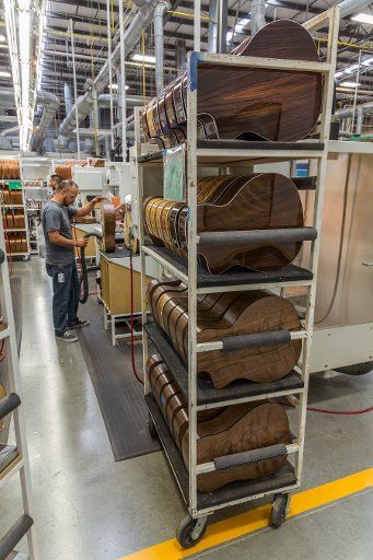 Partially finished guitar bodies in the assembly line at the Taylor Guitar factory in Tecate, Mexico