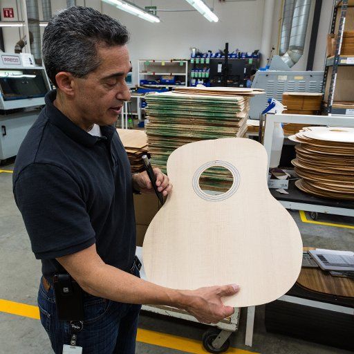 The manager of the Taylor Guitar factory in Tecate, Mexico, explains how guitar tops are glued and shaped