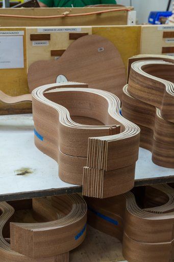 Curved exotic wood guitar sides are paired prior to gluing them together in the Taylor Guitar factory in Tecate, Mexico
