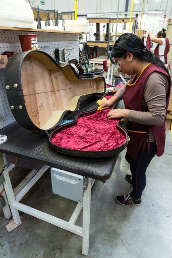 Workers building and assembling guitar cases at the Taylor Guitar factory in Tecate, Mexico
