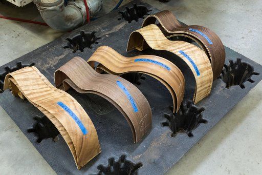 Curved exotic wood guitar sides are paired prior to gluing them together in the Taylor Guitar factory in Tecate, Mexico
