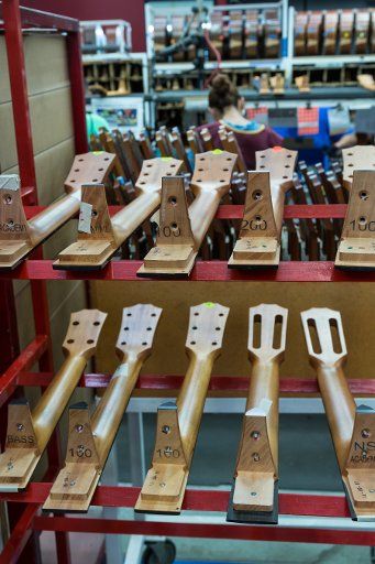 Guitar necks stacked, awaiting assembly in the Taylor Guitar factory in Tecate, Mexico