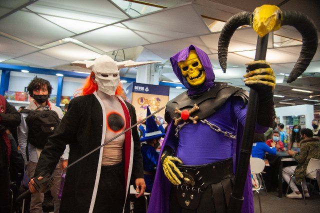 A fan of Hee-Man poses for a photo using a costume of Skeletor during the fourth day of the SOFA (Salon del Ocio y la Fantasia) 2021, a fair aimed to the geek audience in Colombia that mixes Cosplay, gaming, superhero and movie fans from across Colombia, in Bogota, Colombia on October 17, 2021
