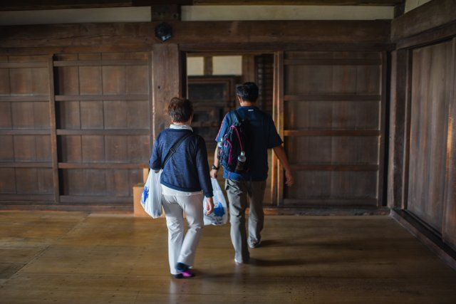 Visitors inside Himeji Castle (HimejijÅ), also known as White Heron Castle, is Japanâs best preserved feudal