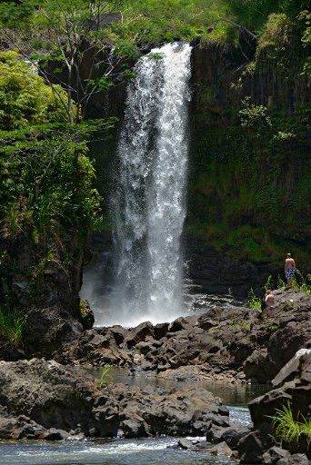 Hawaii, Hilo, Boiling Pots Park, Visitors viewing waterfalls. EDITORIAL USE ONLY.