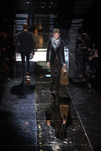 Models walk on the catwalk wearing a creation by Gucci during the Milano Moda Uomo Fall-Winter 2010\/11 in Milan Italy 18 January 2010. The menswear fashion event runs from 16 to 20 January 2010. Photo: Hendrik
