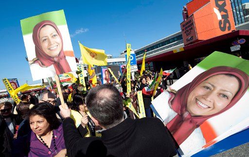 Iranian opposition politician Marjam Radschawi is received by supporters after landing at Berlin\