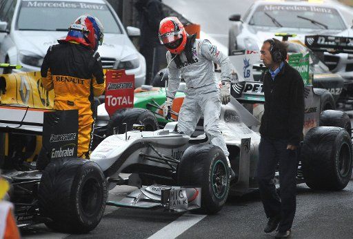 German Formula One driver Michael Schumacher of Mercedes GP gets out of his race car after the Formula One Grand Prix of China at Shanghai International Circuit in Shanghai China 18 April 2010. Schumacher finished tenth. Photo: Peter