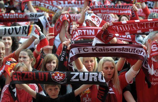 Fans of German Bundesliga second division soccer club FC Kaiserslautern celebrate their team\