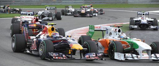German driver Adrian Sutil of Force India (R) and Australian driver Mark Webber of Red Bull push each other at a curve during the Belgian Grand Prix at the Spa-Francorchamps Circuit near Spa Belgium 29 August 2010. The 2010 Formula One Belgian ...