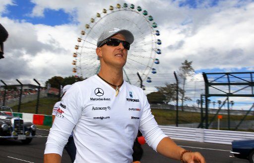 German driver Michael Schumacher of Mercedes GP arrives for the drivers\