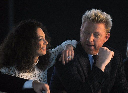 Former tennis-star Boris Becker and his wife Lilly sit at the show \