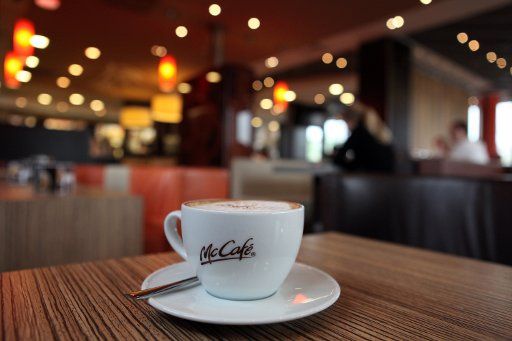 A cup of cappucchino stands at a McDonalds restaurant in Werneck Germany 19 May 2010. Photo: Daniel