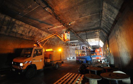 Construction workers repair pipe four of the Elbe Tunnel in Hamburg Germany 5 April 2011. After a lorry burned out inside the tunnel on 31 March 2011 the tunnel will now be cleaned and repaired. Pipe four is said to be opened for traffic on 14 ...