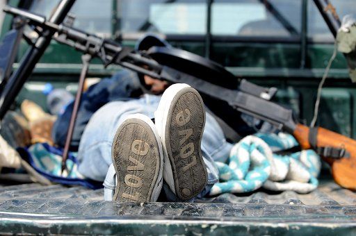 A Libyan rebel rests on the load area of a lorry in Bengasi Libya 06 April 2011. The struggle against troops loyal to Libyan ruler Muammar Gaddafi continues. Photo: MAURIZIO