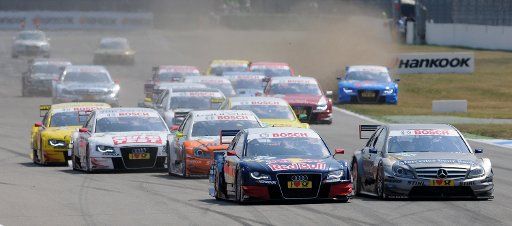 The drivers start at the first race of the German Touring Car Masters in Hockenheim Germany 1 May 2011. Bruno Spengler Mercedes (FRONT-R) won followed by Ekstroem from Schweden Audi (FRONT-L) and Ralf Schumacher (2nd ROW-L). PHOTO: RONAlD ...