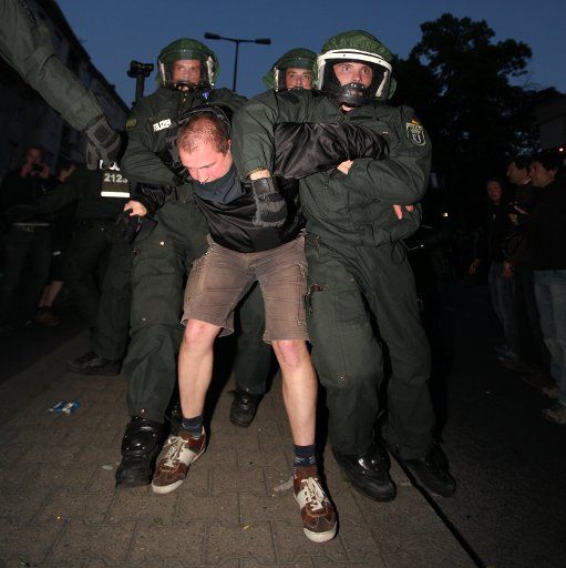 Police officers arrests a demonstrator in Berlin Germany 1 May 2011. Photo: Florian Schuh dpa\/