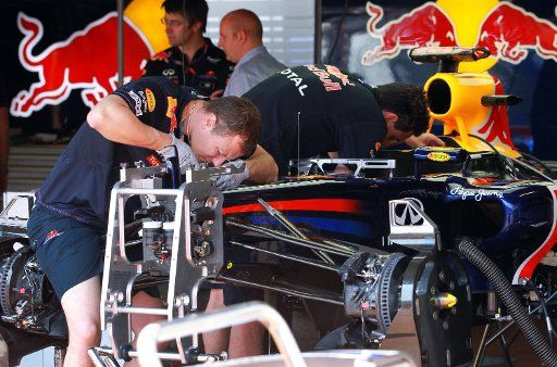 Mechanic of Red Bull work on the car in the box at the F1 race track of Monte Carlo Monaco 25 May 2011. The Grand Prix will take place on 29 May. Photo: Jens Buettner