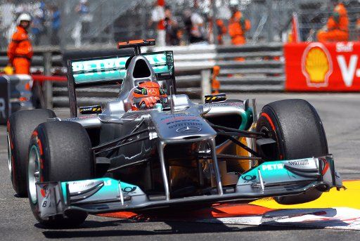 German Formula One driver Michael Schumacher of Mercedes GP comes through Piscine during the Qualifying session at the street circuit of Monte Carlo Monaco 28 May 2011. Vettel claimed Pole Position ahead of Button and Webber. The Formula 1 Grand ...