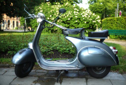 An old Piaggio Vespa stands on a street in Munich Germany 15 May 2011. Photo: Peter