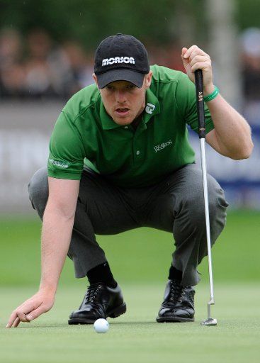 English professional golfer David Horsey eyes the distance of his putt at the BMW International Open 2011 in Eichenried near Munich Germany 24 June 2011. Photo:Andreas
