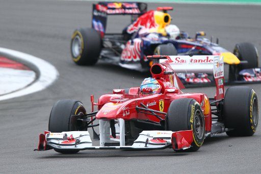 Spanish Formula One driver Fernando Alonso of Ferrari leads in front of Australian Formula One driver Mark Webber of Red Bull during the Formula One Grand Prix of Germany at the F1 race track of Nuerburgring Nuerburg Germany 24 July 2011. Photo: ...