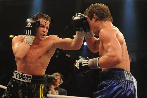 German middleweight boxer Dominik Britsch (L) and US American boxer Billy Lyell fight in Ludwigsburg Germany 22 October 2011. They were fighting for the IBM Intercontinental middleweight Championship. Photo: Franziska