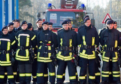 Firefighters line up on the premises of the State School for Fire and Disaster Protection (LSTE) in Eisenhuettenstadt Germany 29 November 2011. Photo: Patrick