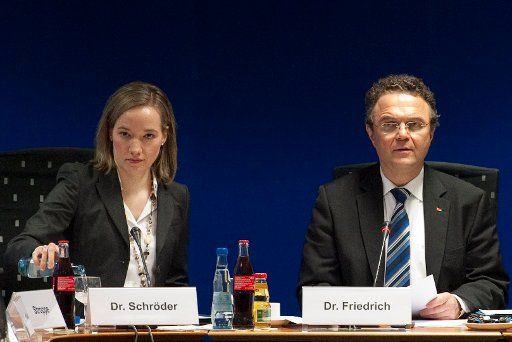 German Minister for Family, Seniors, Women and Youth Kristina Schroeder and German Interior Minister Hans-Peter Friedrich took their seat prior to the head meeting against right-wing extremism at the Ministry of the Interior in Berlin, Germany, 24 ...