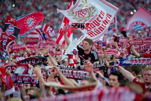 Fans cheer at the Olympic Stadium in Munich where they attended the public viewing of the UEFA Champions League final between Bayern Munich and FC Chelsea in Munich, Germany, 19 May 2012. Chelsea won the game on penalties. Photo: Sven