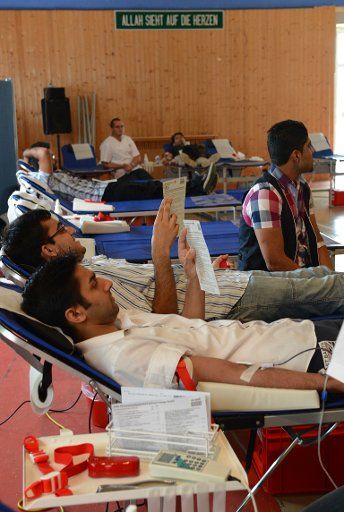 Muslims donate blood at Bait ul Rasheed mosque during a blood donating campaign of the German Red Cross (DRK) and Muslim Ahmadiya movement in Hamburg, Germany, 02 September 2012. This is the first time that blood has been donated in a mosque in ...