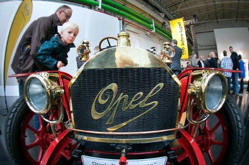 On the occasion of the 150-year anniversary of German car manufacturer Opel, visitors wander the halls of the parent plant in Ruesselheim, Germany, 22 September 2012. The anniversary comes in the midst of a turbulent time of crumbling profits for ...