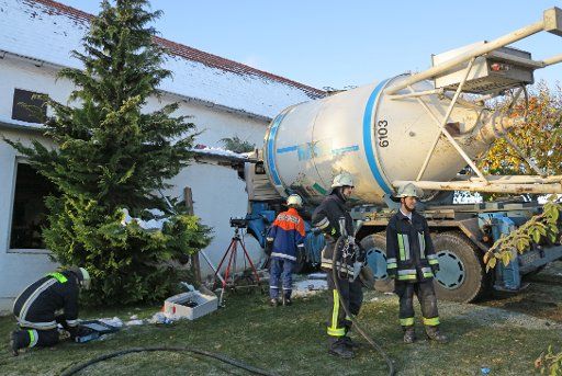 The driver cabin of a truck is stuck in a house in Puch near Fuerstenfeldbrueck, Germany, 31 October 2012. The truck had to swerve a head-on collision, left road and hit the house. Photo: MARC