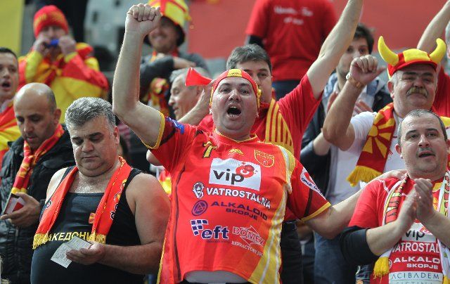Supporters of Macedonia cheer before the start of the men\