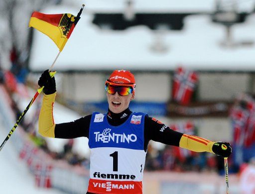 Eric Frenzel of Germany crosses the finish line to win the Cross Country portion of the Nordic Combined Individual Large Hill \/ Gundersen competition at the Nordic Skiing World Championships in Val di Fiemme, Italy, 28 February 2013. Photo: Hendrik ...