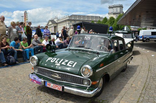 An Opel Captain Police car is driven at the Hesse State Exhibition in Kassel, Germany, 15 June 2013. The festival about the German state of Hesse continues until 23 June. Photo: UWE 