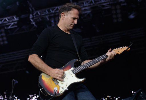 Keith Scott, guitarist of the band of Canadian singer Bryan Adams performs on a stage of the Stadtpark (city park) in Hamburg, Germany, 20 June 2013. Photo: Axel