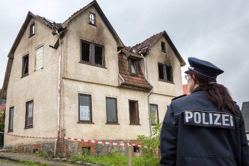 Rescue works investigate a burned out home in Brotterode, Germany, 03 July 2013. An seven year old girl died in the fire during the night. Photo: MICHAEL 