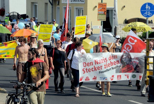 Demonstrators protest against a planned far-right wing rock concert in Finowfurt, Germany, 27 July 2013. Photo: BERND 