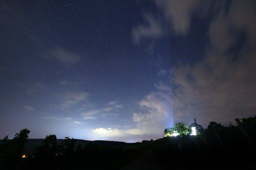 The night sky above the vineyards around Vogelsburg Abbey near Escherndorf, Germany, 14 August 2013. Photo: KARL-JOSEF