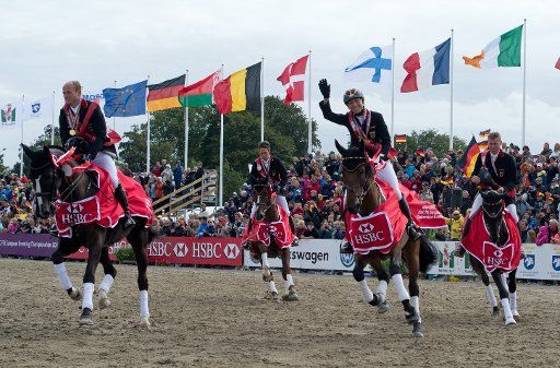 German eventers Michael Jung on Halunke, Dirk Schrade on Hop and Skip, Ingrid Klimke on Escada and Andreas Dibowski on Butts Avedon ride after winning the team score of the European Eventing Championships in Malmo, Sweden, 01 September 2013. Photo: ...