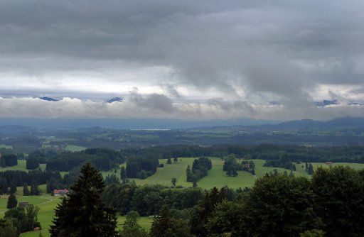 29 July 2019, Bavaria, Stötten: The foothills of the Alps below the Auerberg are covered with clouds. Photo: Karl-Josef Hildenbrand\/